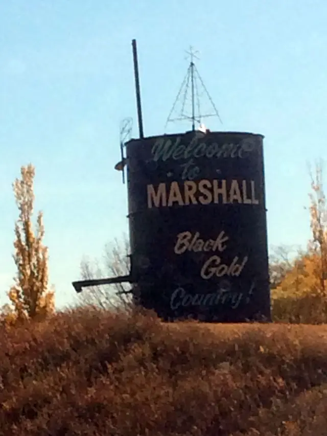 Welcome to Marshall sign on an old tank